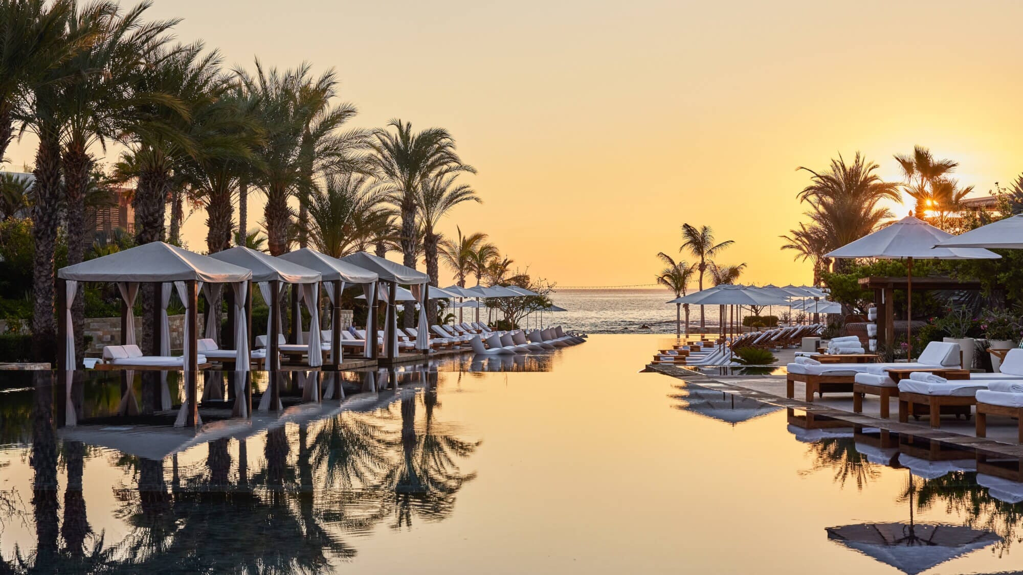 Family Adventure Awaits at Chileno Bay Resort: Family kayaking together in the crystal-clear waters of Cabo San Lucas